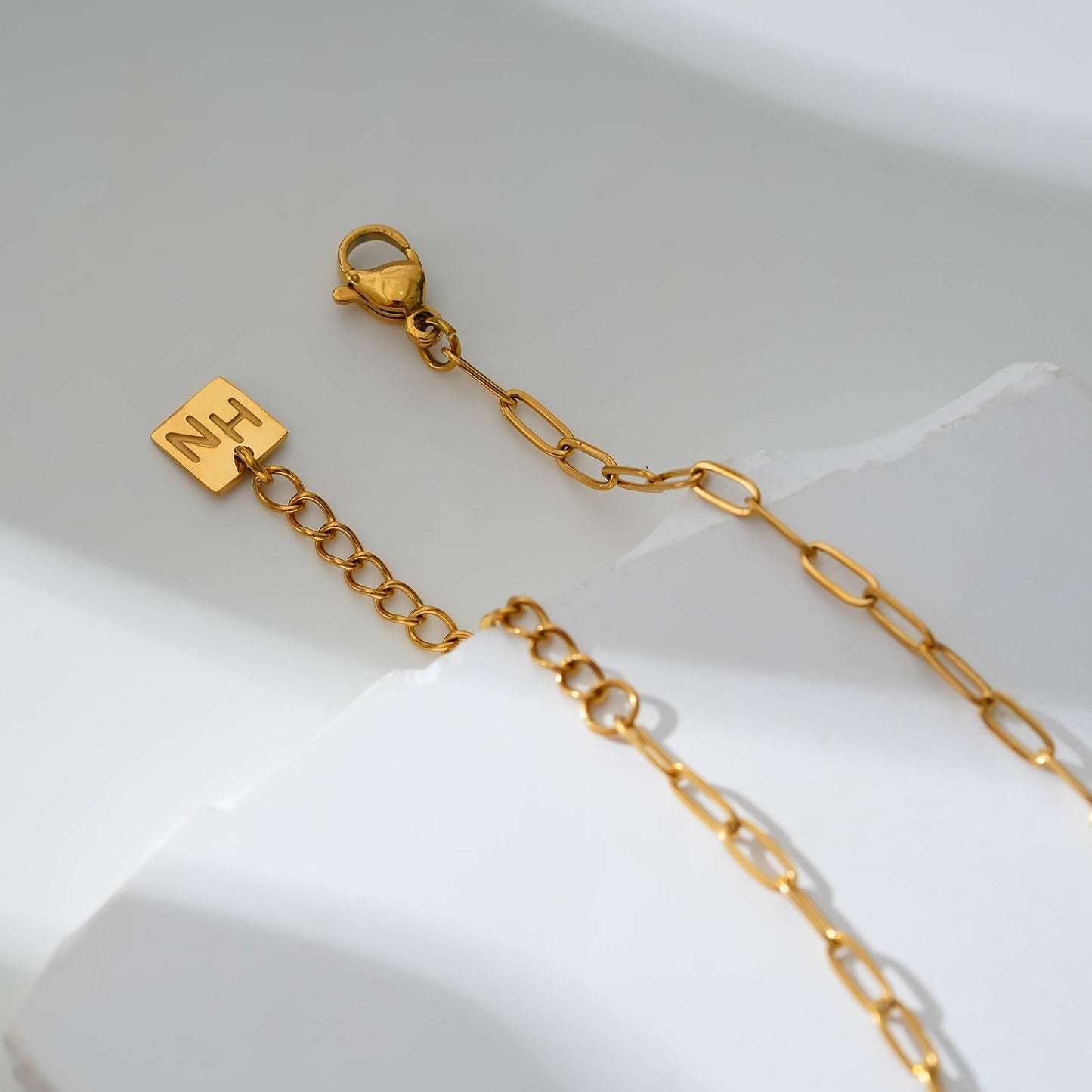 CANARI : Chaîne de cheville mini trombone avec charms zircone