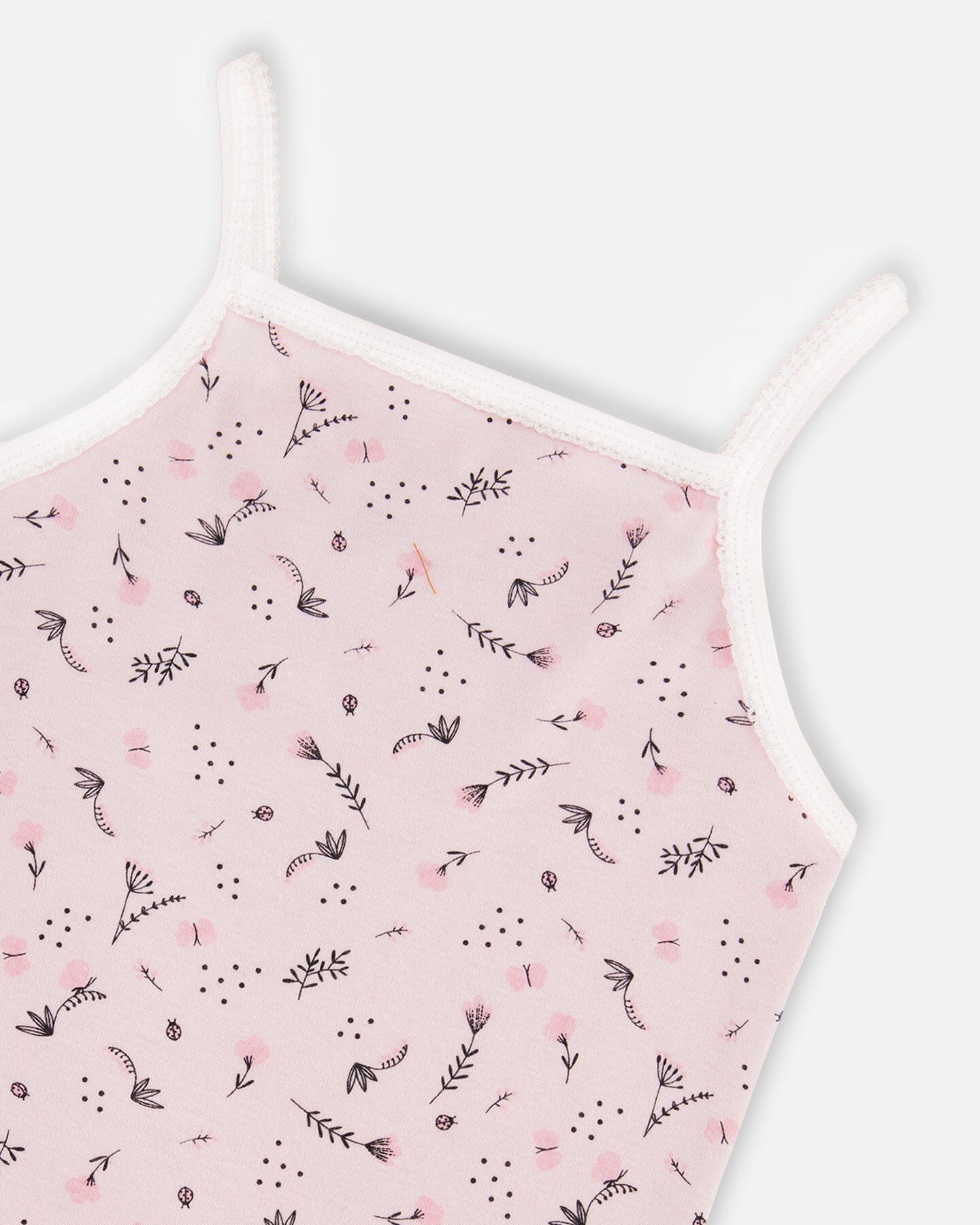 Débardeur en coton biologique imprimé petites fleurs roses sur fond rose pâle