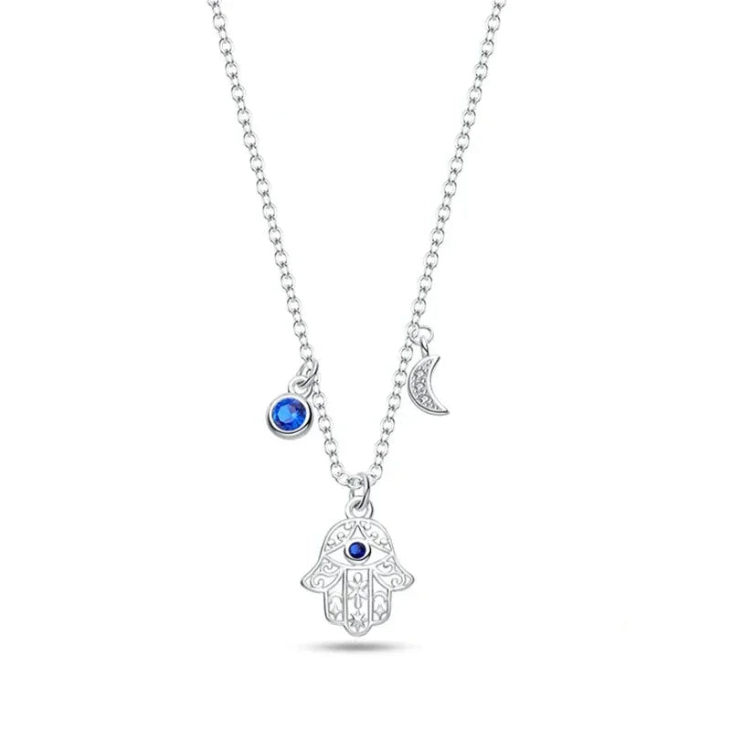 Pendentif en argent sterling en forme de main avec lune et œil protecteur
