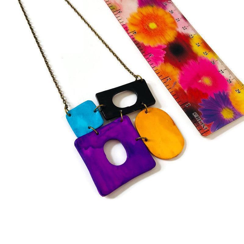 Collier pendentif audacieux Color Block, design quatre pièces, fait main en pâte polymère