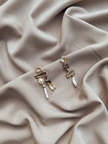 Les boucles d'oreilles asymétriques Kenzie