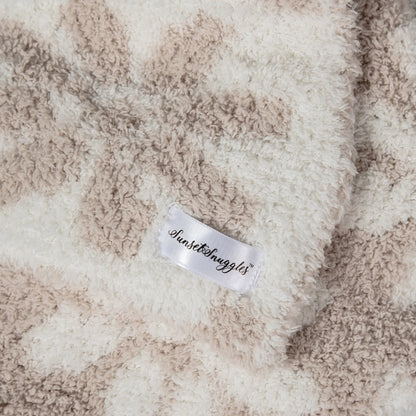 Couverture pour tout-petit imprimée marguerites beiges et blanches