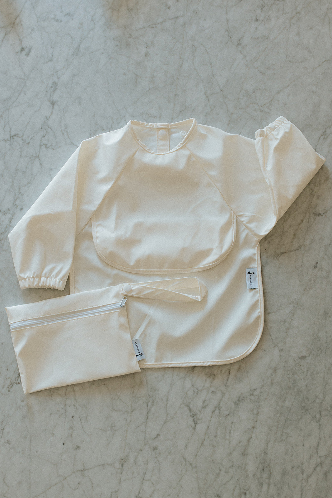 Bavette imperméable à manches longues avec poche | 6-24 mois