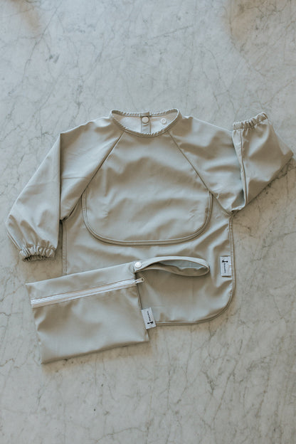 Bavette imperméable à manches longues avec poche | 6-24 mois