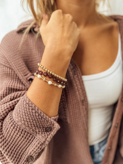 Le bracelet et la chaîne de cheville Merlot Daisy