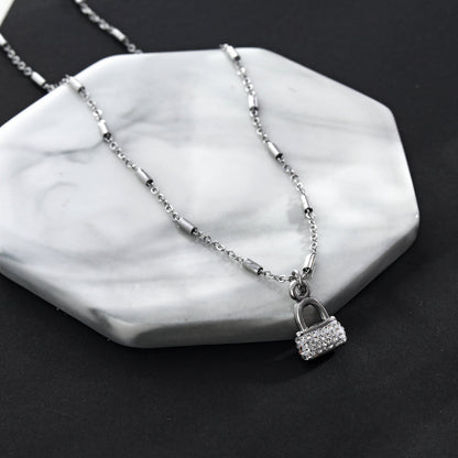 Collier chaîne à billes ABENI avec pendentif cadenas pavé en zircone en argent
