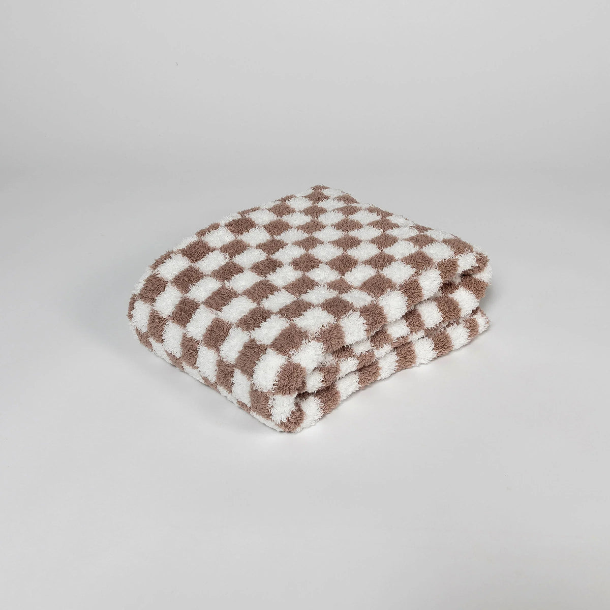 Couverture pour tout-petit à carreaux blancs et couleur chocolat