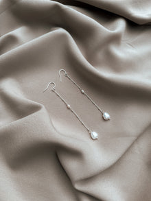 Les boucles d'oreilles pendantes Kate