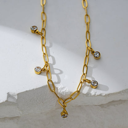 CANARI : Chaîne de cheville mini trombone avec charms zircone