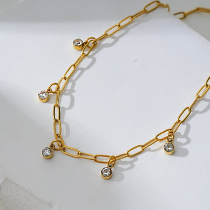 CANARI : Chaîne de cheville mini trombone avec charms zircone