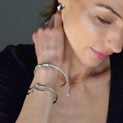 CHITRA: Industrial-Chic Bracelet with Abstract Shaped Parallel Bands in Silver Toned White Gold