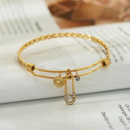 CHRISTINA : Bracelet en Or Orné de Breloques