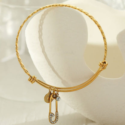 CHRISTINA : Bracelet en Or Orné de Breloques