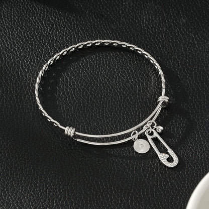 CHRISTINA : Bracelet en or blanc (ton argenté) orné de breloques