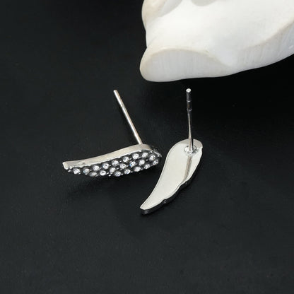 COMPTON Or blanc (ton argenté) : Boucles d'oreilles clous en forme d'aile avec pavé de zircone éblouissant – Un éclat élégant pour chaque occasion