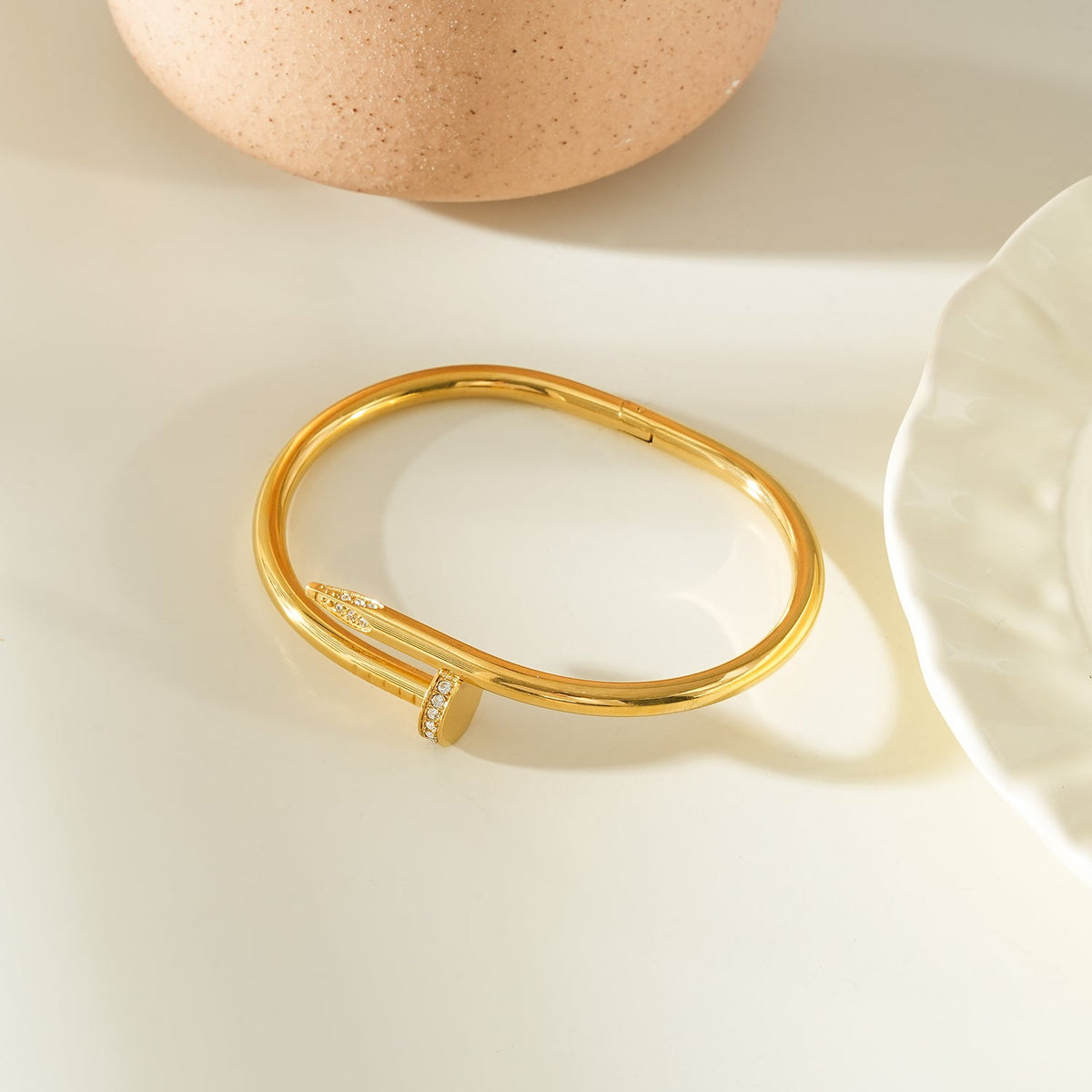 DAVIDKA Gold: Zirconia Embedded Industrial-Chic Twisted Nail Bracelet