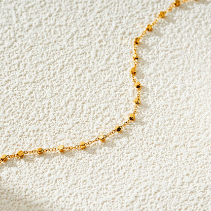 DEMELZA LG : Cheville contemporaine dorée avec perles carrées délicates