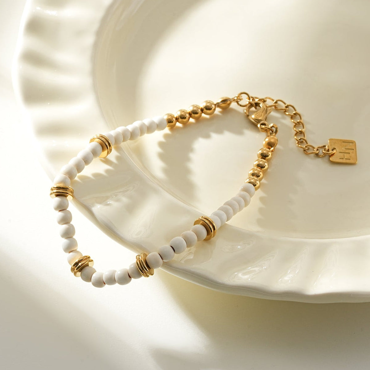 JAMILAH Gold: White Turquoise Stones and Gold Beaded Bracelet.
