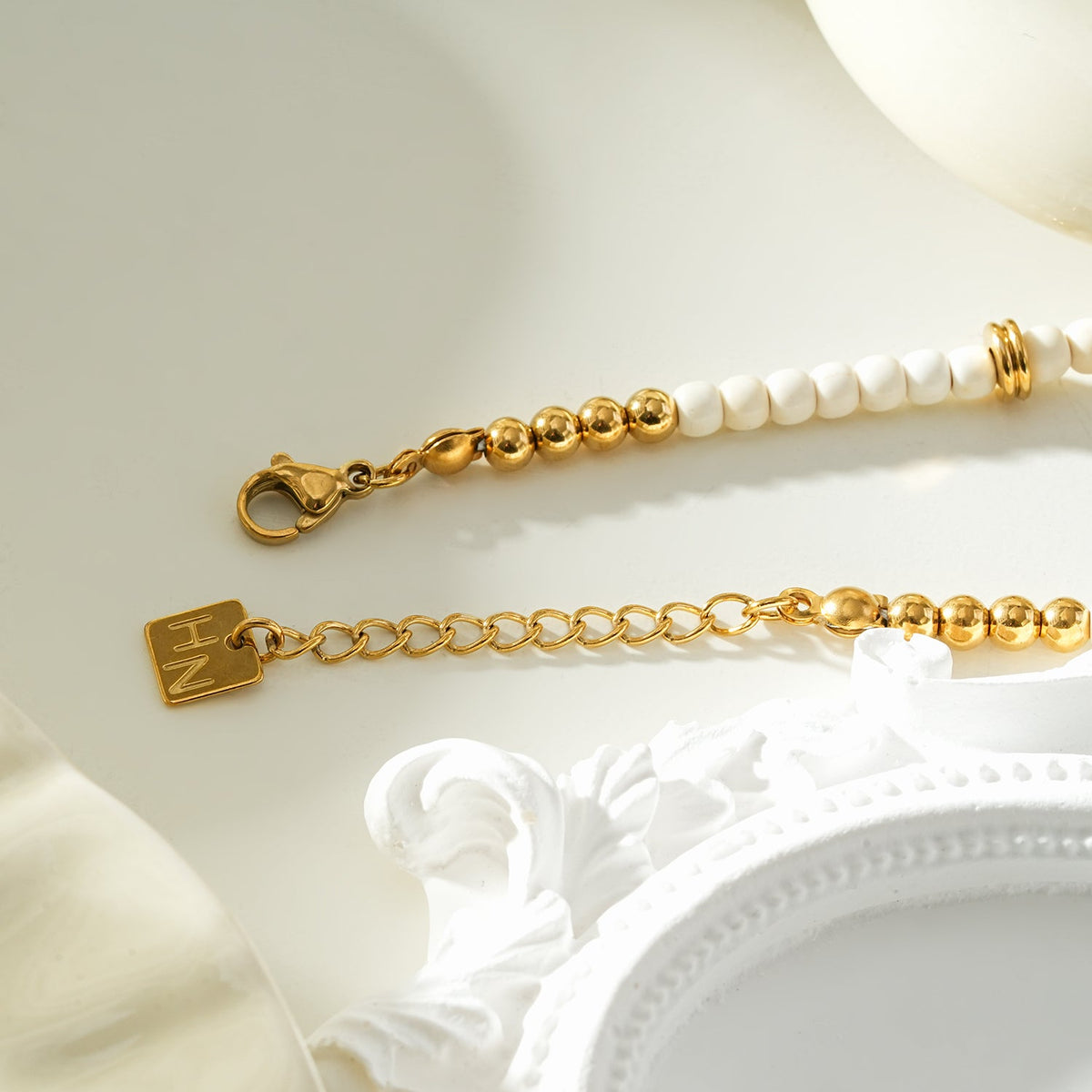 JAMILAH Gold: White Turquoise Stones and Gold Beaded Bracelet.