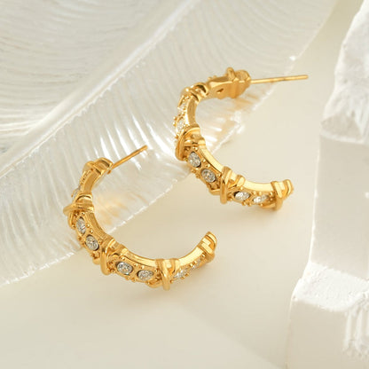 ELICA Gold: Zirconia Embedded Hoop Earrings with Ornate Detail &  Crisscross Accents