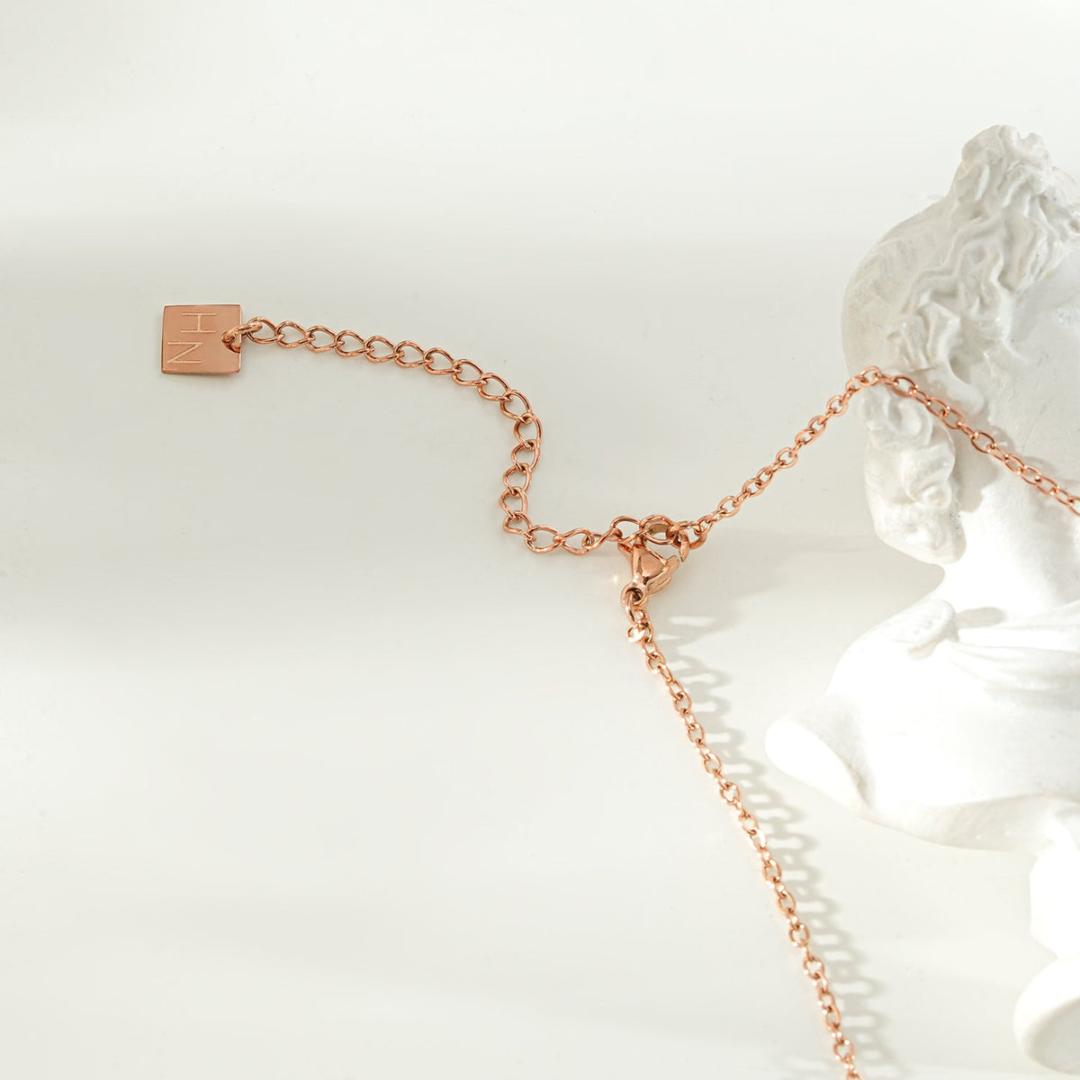 LAVINIA Gold: Square Gold Pendant Necklace with Cut-Away Shell Star and Mini Zirconia Charm