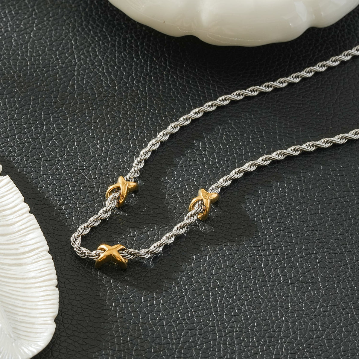 COSMINA Mixed Metals: Silver Rope Chain Necklace with Triple Mini Gold Criss-Cross Charms