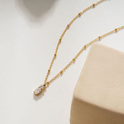 CABBANA Gold : Un ensemble duo de pendentifs breloques en zircone sur un collier chaîne perlée