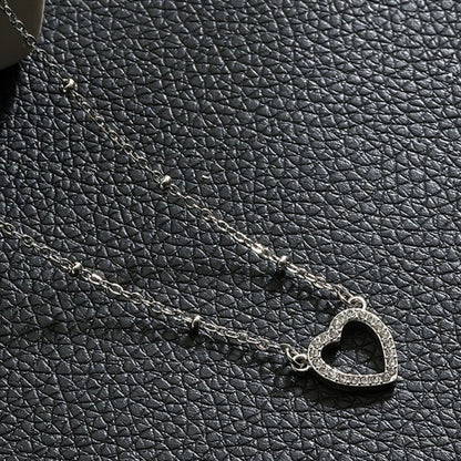 CHERISH Argent (Or blanc) : Chaîne perlée retenant un élégant pendentif cœur pavé