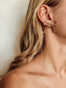 Les boucles d'oreilles nœud Nina