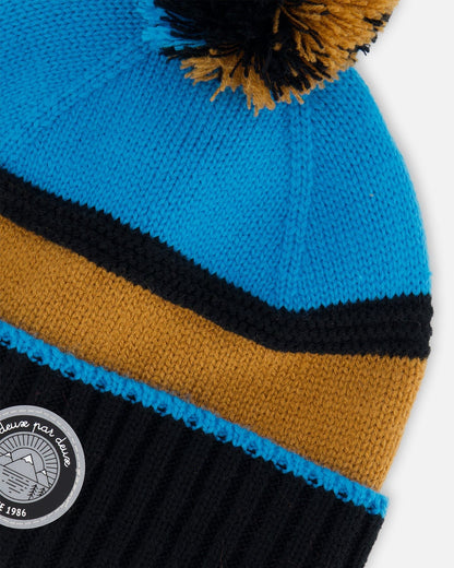Bonnet en maille bleu, noir et cannelle