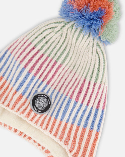 Bonnet péruvien en tricot aux couleurs pastel avec pompons