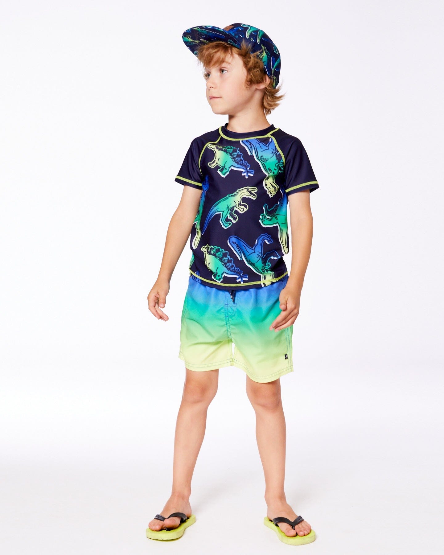 Haut anti-UV manches courtes dinosaures bleus et verts sur fond marine