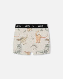 Short imprimé en coton biologique, motif dinosaure sur fond tacheté et havane
