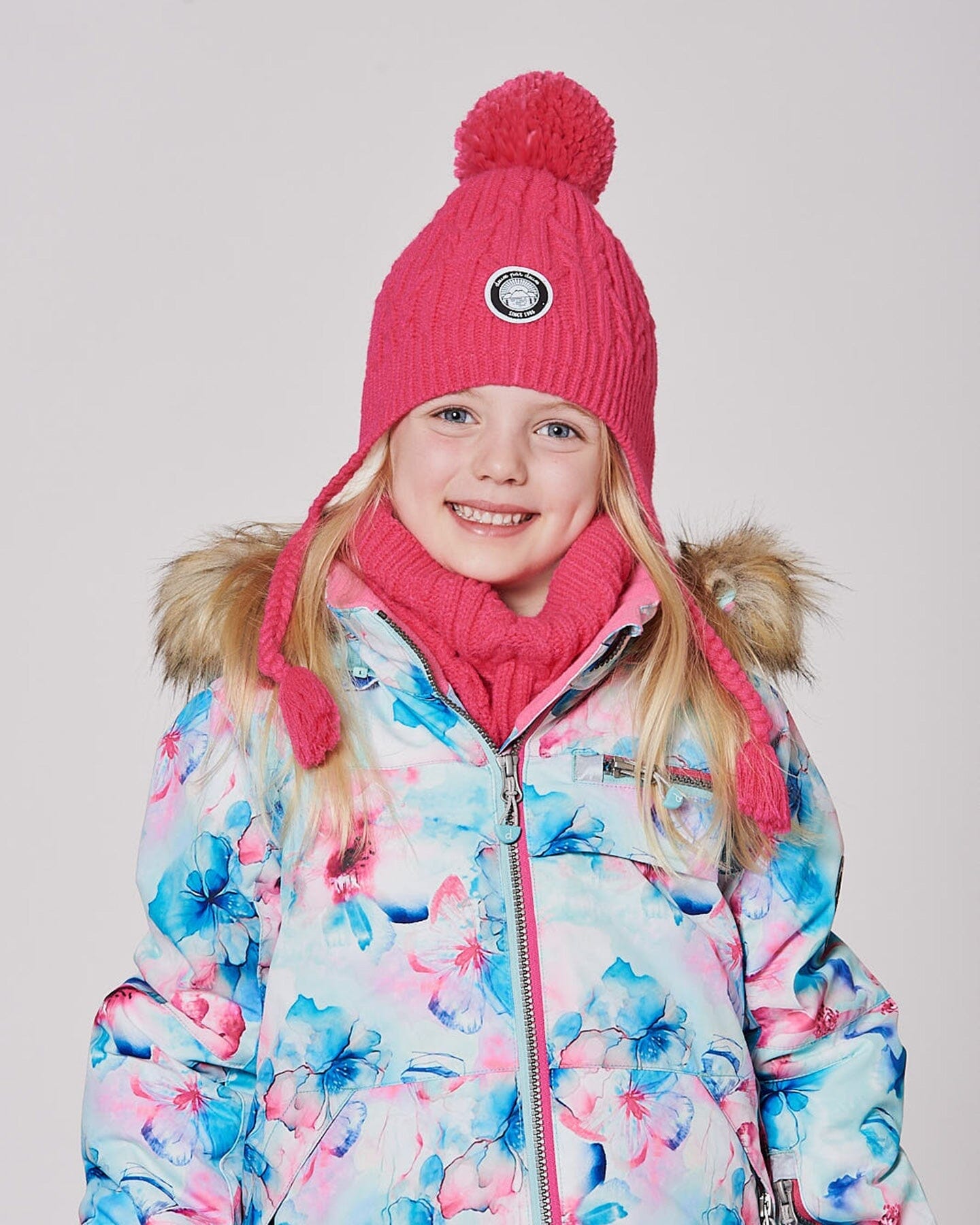 Bonnet d'hiver doublé avec pompon corail flash