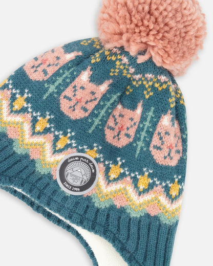 Bonnet péruvien en tricot doublé à pompon vert et rose
