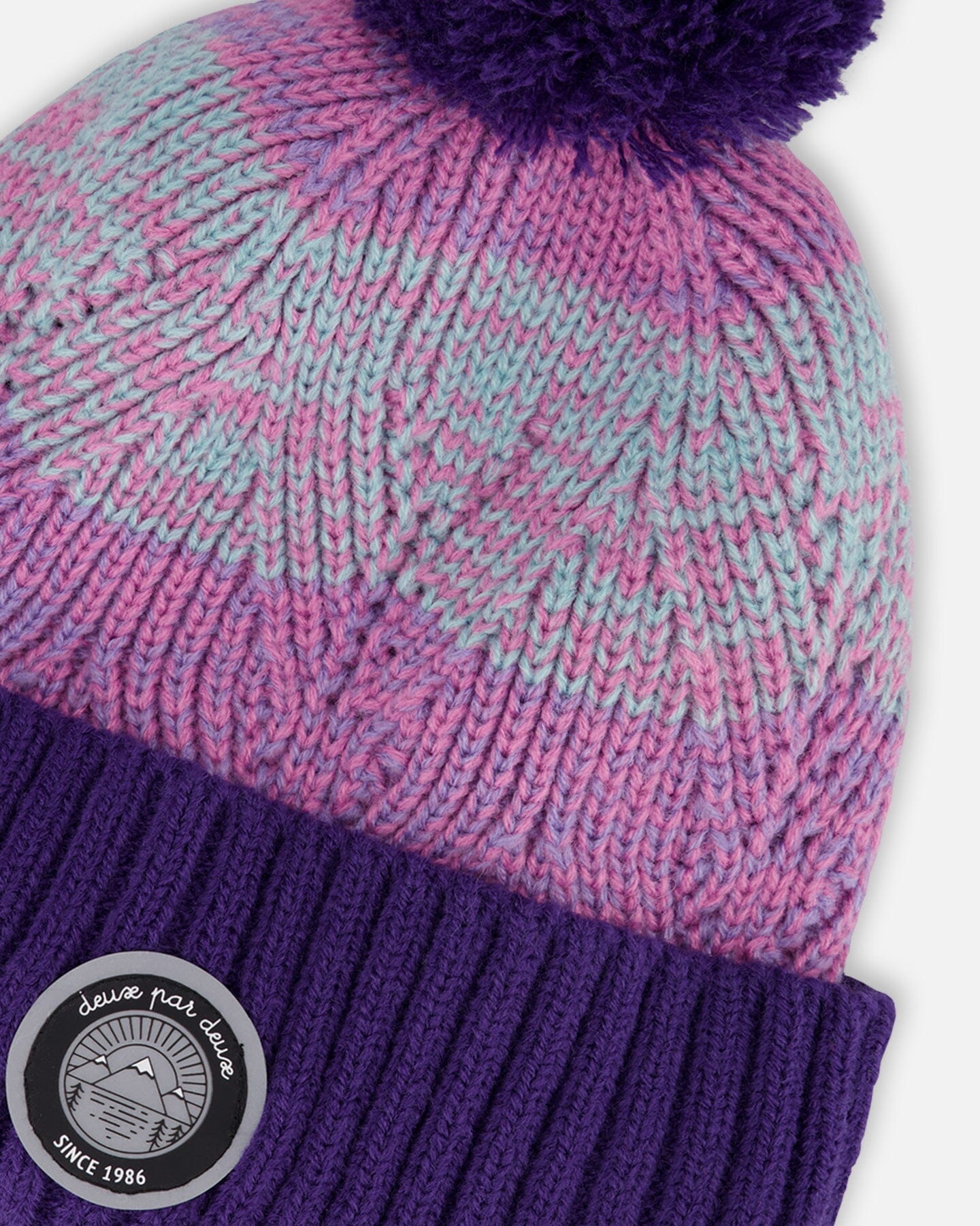 Bonnet en tricot doublé à pompon violet et rose