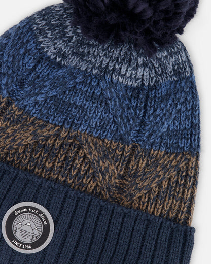 Bonnet en maille doublé à pompon taupe et marine