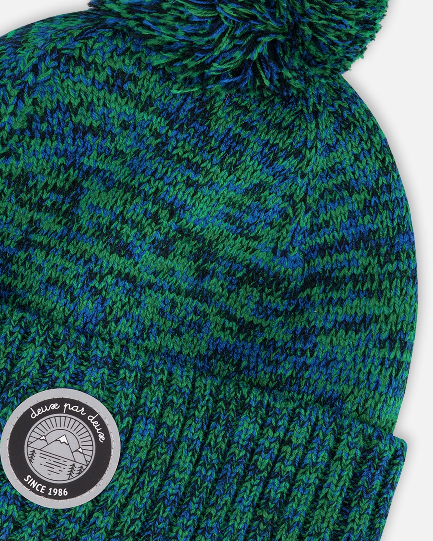 Bonnet en tricot doublé à pompon vert et bleu