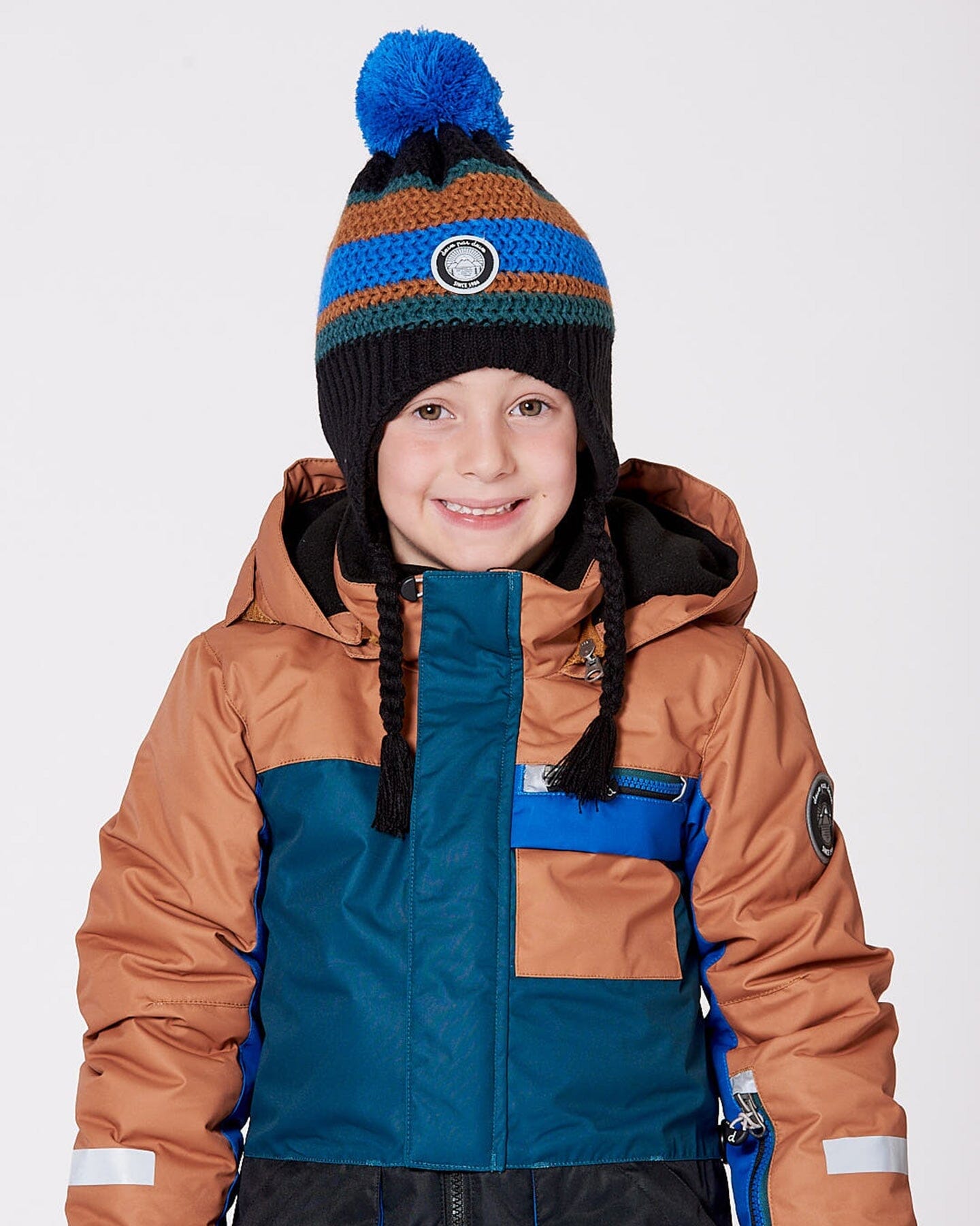 Bonnet péruvien en maille doublé avec pompon noir, bleu et marron