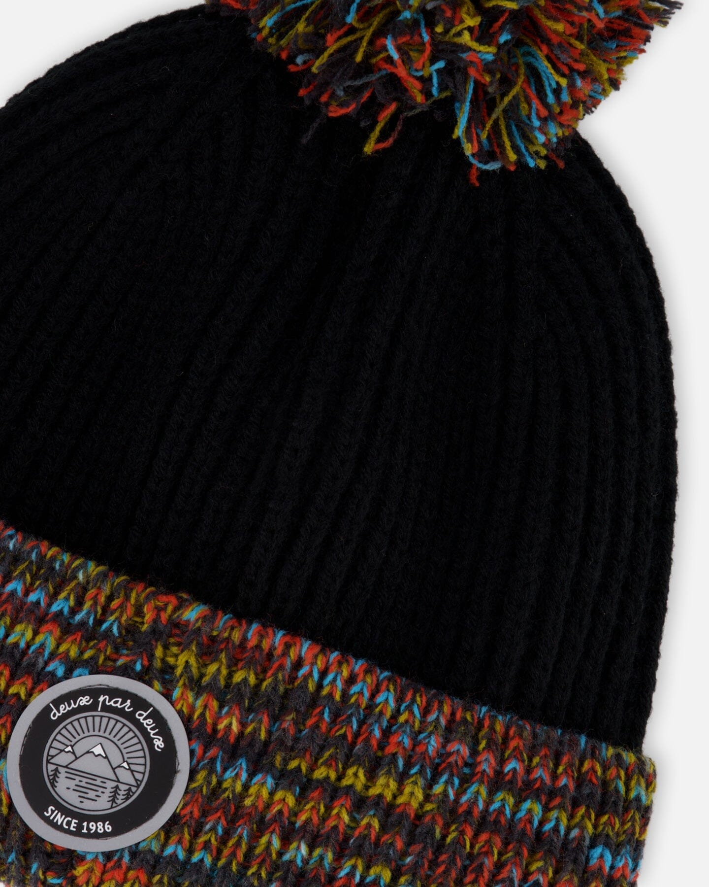 Bonnet d'hiver en maille doublé avec pompon noir et multicolore