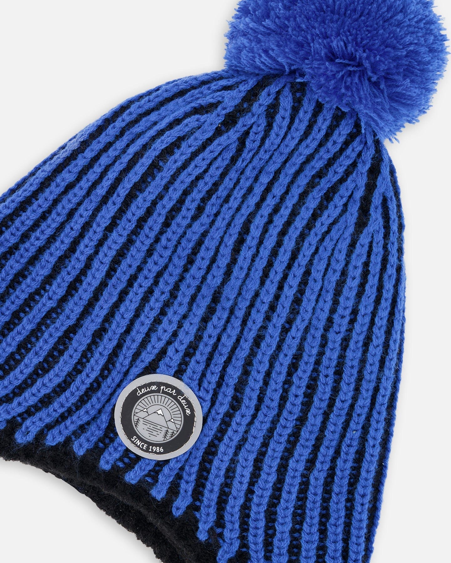 Bonnet péruvien en tricot avec pompon et doublure noir et bleu