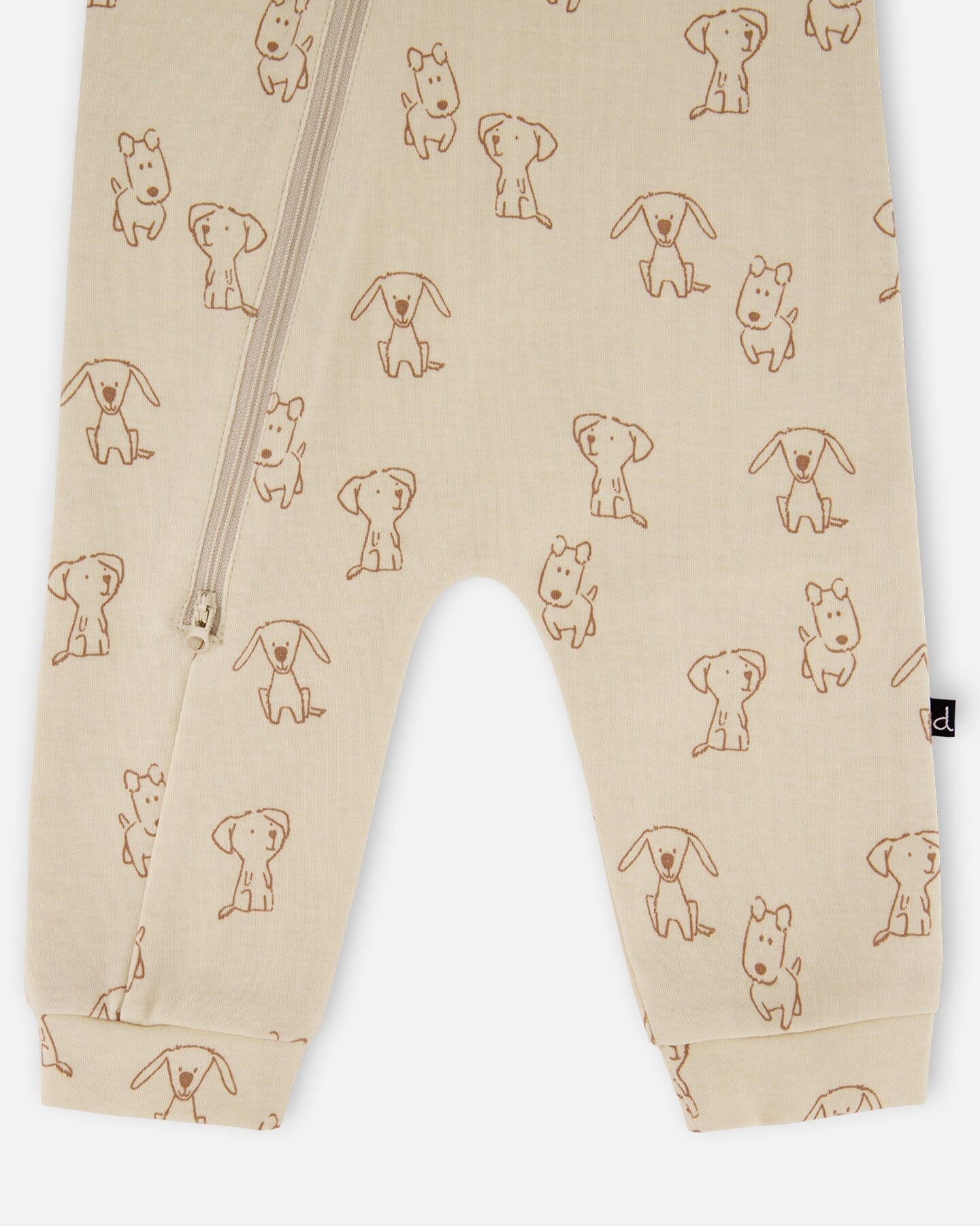 Grenouillère zippée en coton bio motif chiot beige