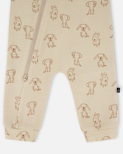 Grenouillère zippée en coton bio motif chiot beige