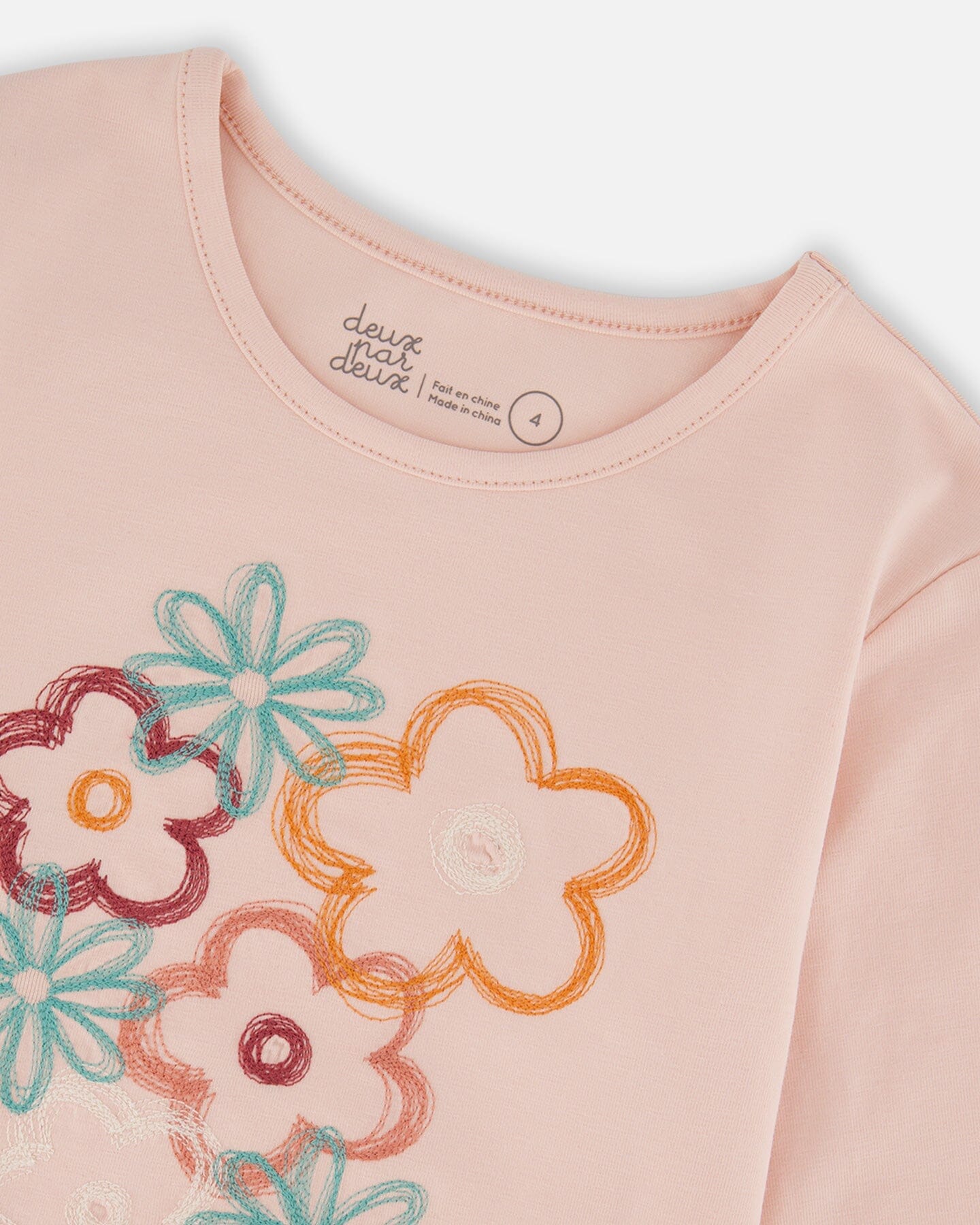 T-shirt manches longues en coton biologique rose clair à grandes fleurs