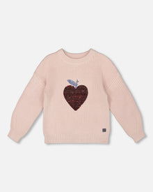 Pull en maille blanc rosé avec cœur à paillettes