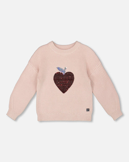 Pull en maille blanc rosé avec cœur à paillettes