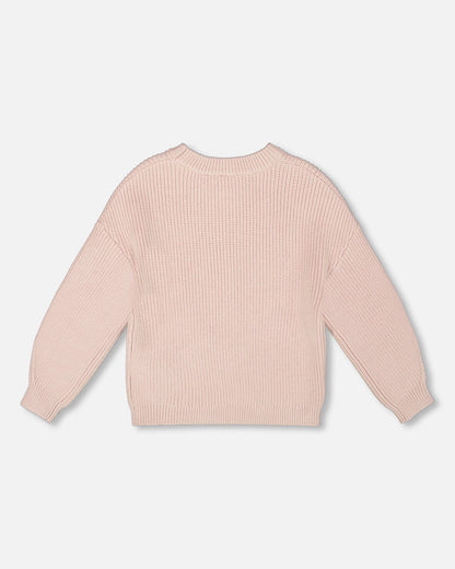 Pull en maille blanc rosé avec cœur à paillettes