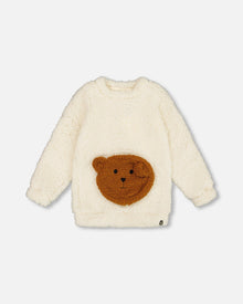 Tunique en peluche blanc cassé avec poche ourson