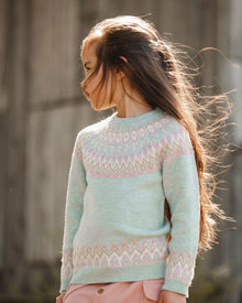 Pull en jacquard norvégien bleu turquoise