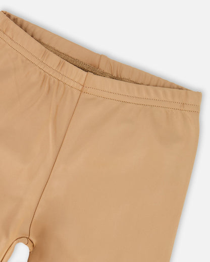 Legging extensible brillant beige doré